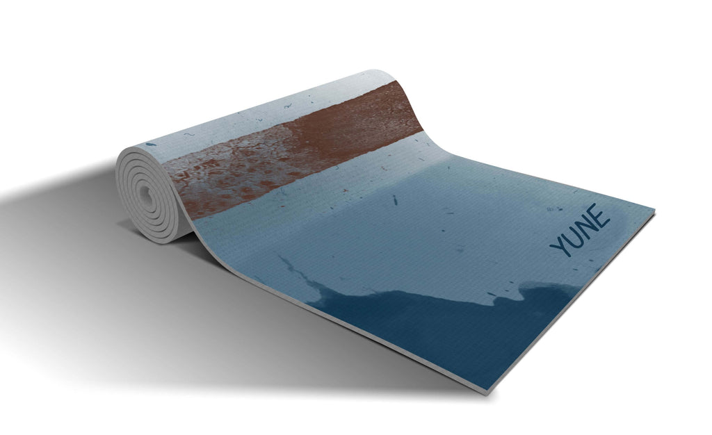 Yune Yoga mat in tan and blue colors, 6mm thick, non-slip, eco-friendly, perfect for all exercises.